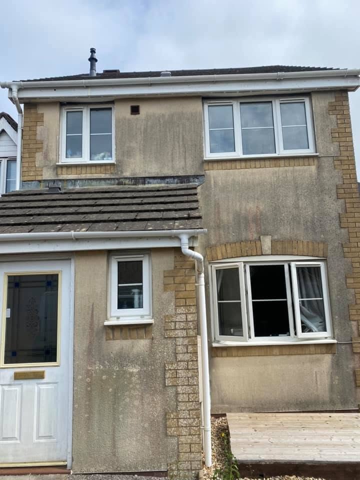 Stained residential render before cleaning