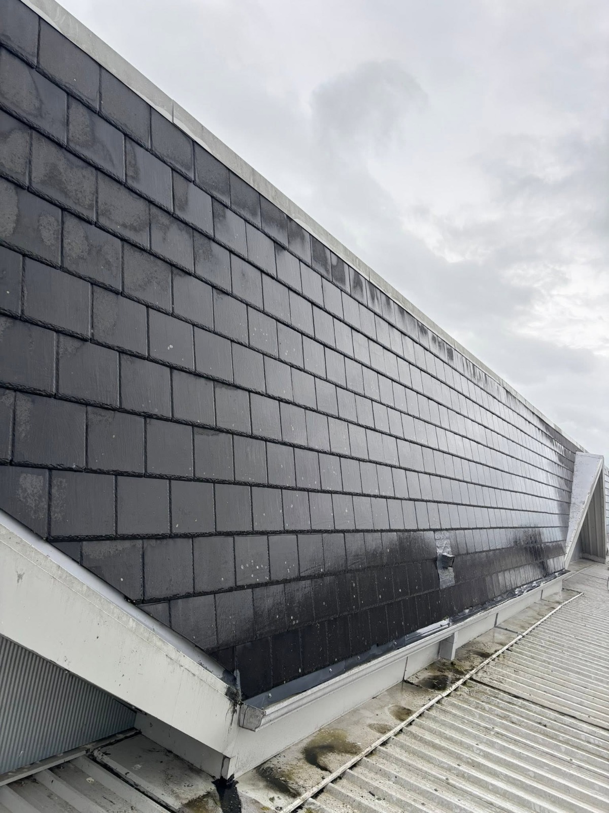 Clean roof slate after treatment