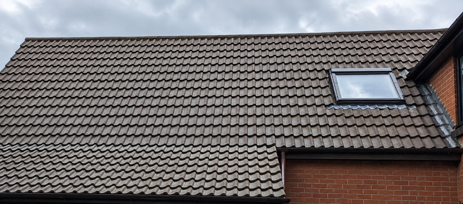 Restored roof tiles after moss removal